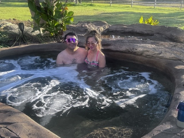 Guests enjoying the ranch hot tub