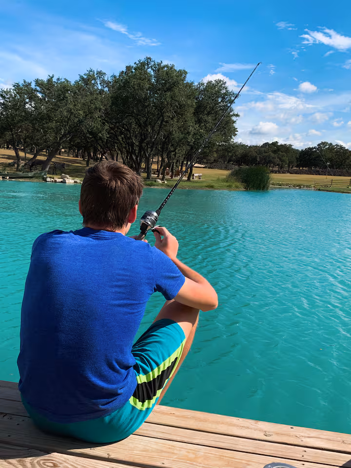 Guest fishing from the ranch dock