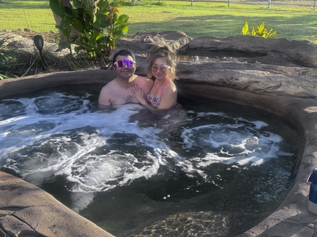 Guests relaxing in the ranch hot tub