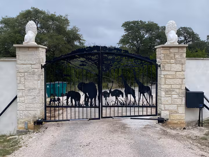 Entrance gate decorated with animal silhouettes