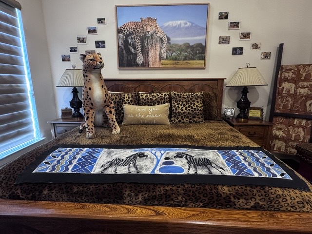 Safari-themed bedding and leopard artwork in the Wild Safari Room